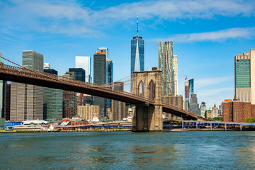 famous skyline of downtown new york and brooklin bridge