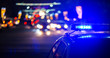 Leinwandbild Motiv night police car lights in city - close-up with selective focus and bokeh