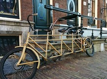 Tandem Bicycle Parked Outside House