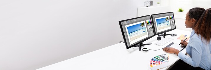 Designer Editing Photos On Computer