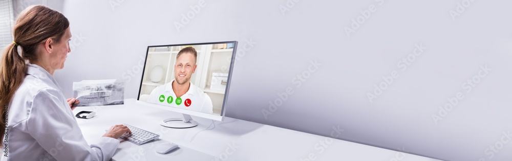 Dentist Video Conferencing With Man On Computer - obrazy, fototapety, plakaty 