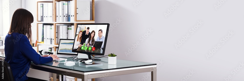 Businesswoman Video Conferencing On Computer - obrazy, fototapety, plakaty 