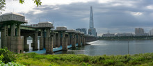 Panorama View Of Jamsil Bridge Across Han River With Lotte World Tower On The Background.