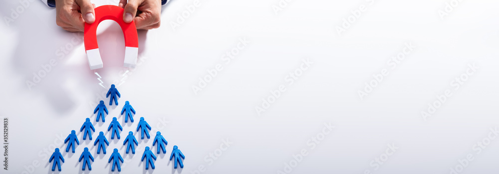 Businessman Attracting Blue Team With Horseshoe Magnet - obrazy, fototapety, plakaty 