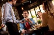© BGStock72 - Young man paying with contactless credit card in restaurant after dinner