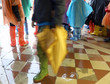 © ChiccoDodiFC - people with boots during the flood in Venice in Italy
