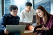 © zephyr_p - Business meeting and teamwork concept. Asian businesswoman explaining project data report to colleagues using digital tablet for presentation at workplace. Coworkers team brainstorming ideas in office