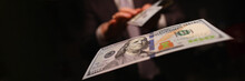 Man In Business Suit Litter Money, Dollars Closeup