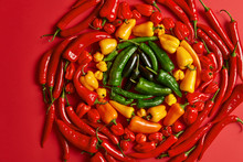 Selection Of Green Yellow Red Chili Pepper Arranged In Circle. Hot Ingredient For Preparing Spicy Dish. Chilli In Different Variations. Top View. Vegetables Collected From Garden Ready To Sale