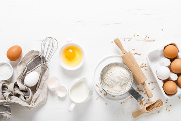 Poster - Baking homemade bread on white kitchen worktop with ingredients for cooking, culinary background, copy space, overhead view