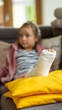 girl with a broken leg in a cast on the couch