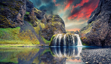 Fantastic Evening Landscape With Colorful Skyover The Waterfall During Sunset. Amazing Icelandic Nature. Best Famouse Travel Locations. Image Of Wild Nature. Tipical Icelandic Countryscape. Postcard