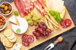 © Evgeny Karandaev - Cheese, meat, grapes and olives antipasto