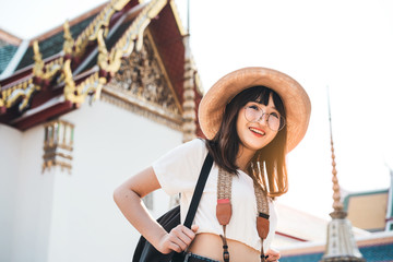 Wall Mural - Young asian college teenager solo traveling outdoor famous destination.