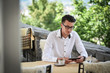 © Visionsi - Young fashion Businessman drinking espresso coffee in the city cafe during lunch time and working on smartphone