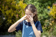 © nacho roca - Little girl rubbing her eyes from an itchy allergy in the garden