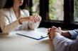 © bnenin - Talking to a client at business meeting, close-up.