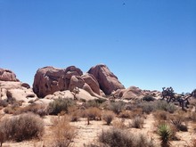 Scenic View Of Eroded Rocks At Arid Landscape