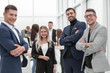 © ASDF - project Manager and working group standing in office