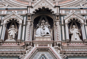 Exterior / facade of the Cathedral of Santa Maria del Fiore in Florence, Italy. Close shot of decoration and art of the front fasade of the cathedral