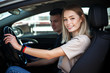 © Kobrinphoto - Driving instructor and woman student in examination car.