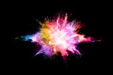 Wall Mural - abstract colored dust explosion on a black background.abstract powder splatted background,Freeze motion of color powder exploding/throwing color powder, multicolored glitter texture.
