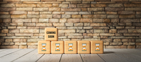Wall Mural - cube with message COMING SOON in front of a brick wall