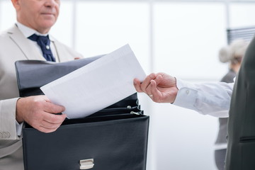 Canvas Print - close up. businessman receiving document from Bank employee.