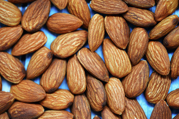 Wall Mural - Almonds texture background / Roasted almond nut
