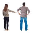 © ghoststone - Back view of couple in sweater with mobile phone.