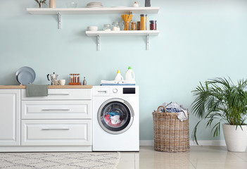 Wall Mural - Interior of kitchen with modern washing machine