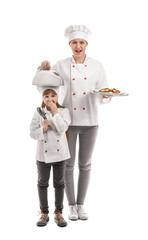 Canvas Print - Portrait of female chef and her little daughter on white background