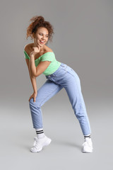 Poster - African-American hip-hop dancer on grey background