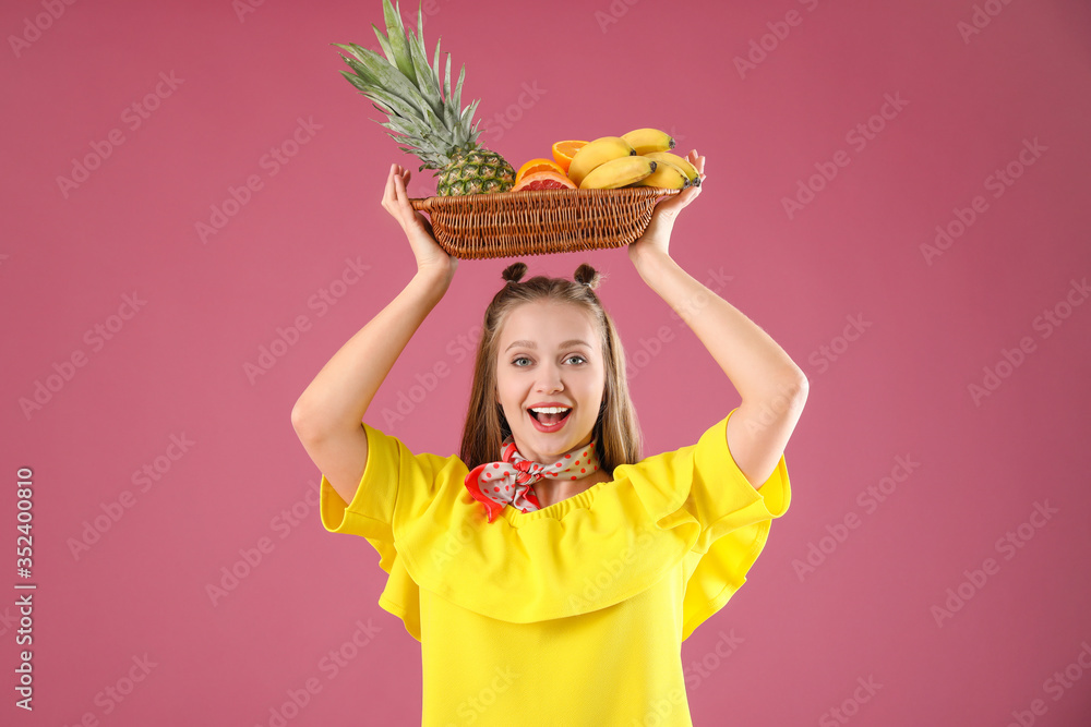 Young woman with fruits on color background. Diet concept