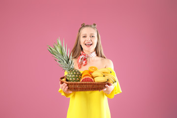 Wall Mural - Young woman with fruits on color background. Diet concept