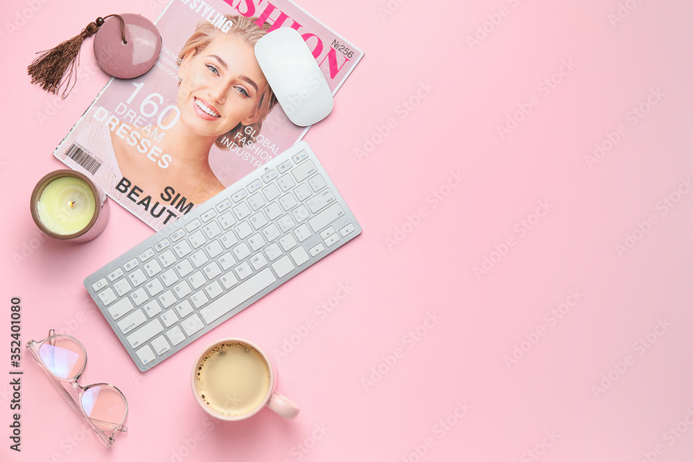 Computer keyboard with candle, fashion magazine and cup of coffee on color background - obrazy, fototapety, plakaty 