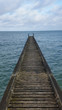 Wooden Pier Over Calm Sea Against Sky