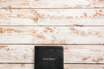 Holy Bible on wooden background