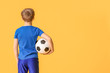 © Pixel-Shot - Cute little boy with soccer ball on color background