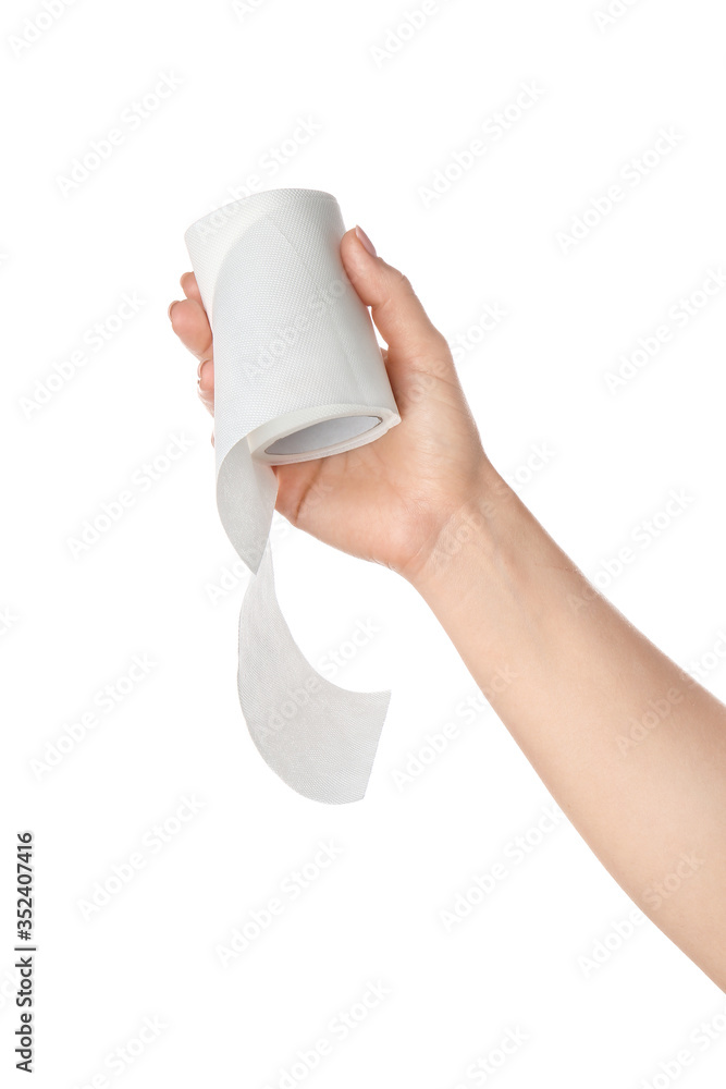 Hand with roll of toilet paper on white background