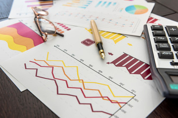 financial charts, work at paper business diagram with pen, at office.