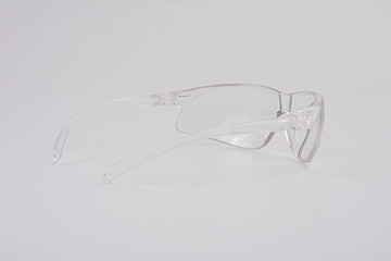 Transparent safety glasses on a white background