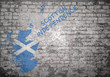 Grunge decayed faded brick wall background with the map flag of Scotland with independence from the United Kingdom message