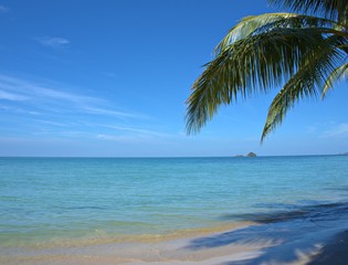 Beautiful sand beach with blue sky cloud ,splash sea water with coconut tree for background and wallpaper, summer holiday at  Koh Chang island ,Thailand