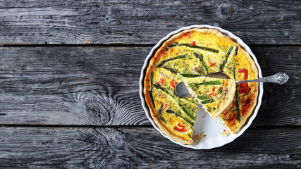 Wall Mural - tasty quiche with salmon asparagus cheese filling