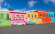 South Africa - Cape Town - The colorful multicolored houses, cottages and cars on steep street in Bo-Kaap borough, one of Cape Town's symbol