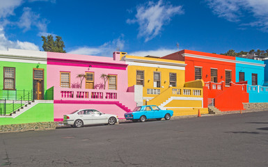 south africa - cape town - the colorful multicolored houses, cottages and cars on steep street in bo