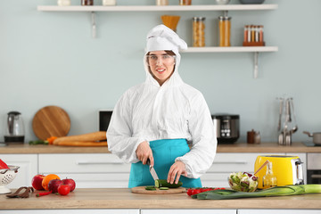 Sticker - Housewife in protective costume cooking in kitchen