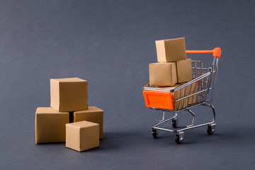 Photo of store pushcart carrying carton boxes delivering fast service order client e-commerce isolated over dark pastel grey color background