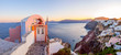 Santorini Panorama. Traditional white cave houses on a cliff on the island Santorini, Cyclades, Greece